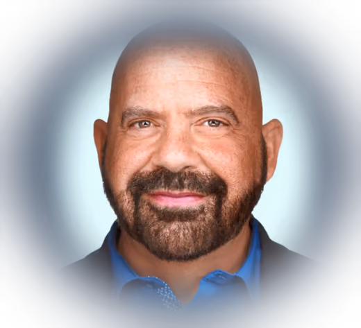 Portrait of Stephen Gilfus on a deep navy background with a soft halo